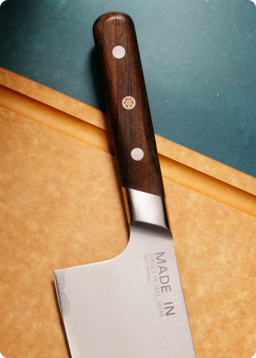 Limited edition Kamagata knife with Rosewood handle on a cutting board