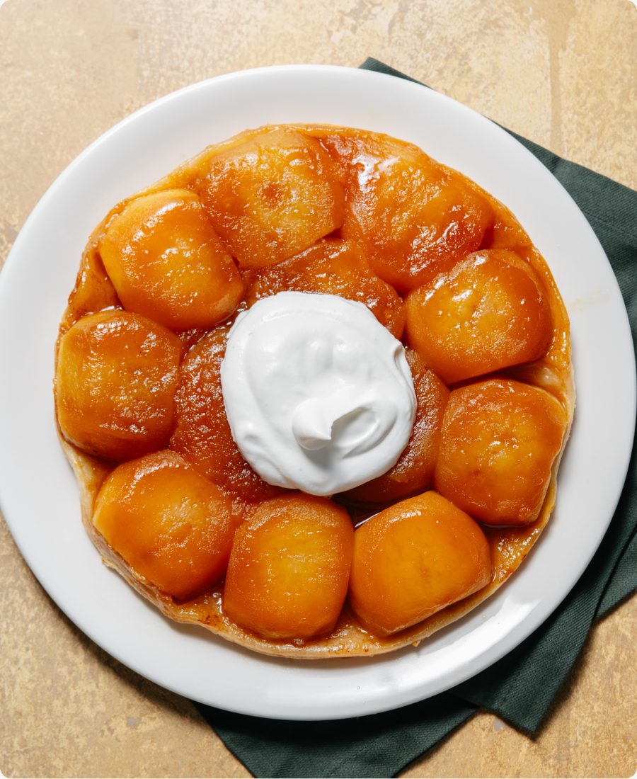 Tarte Tatin topped with whipped cream