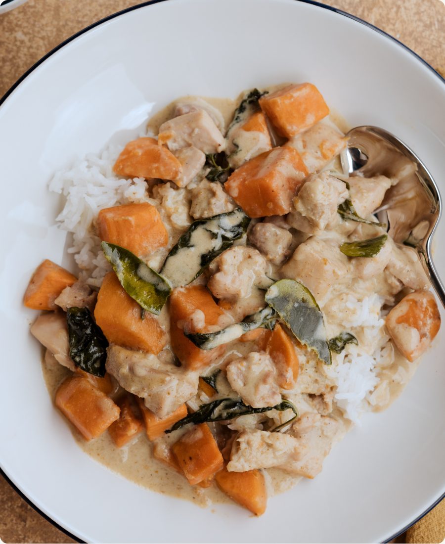 Thai green curry with chicken and sweet potatoes over rice