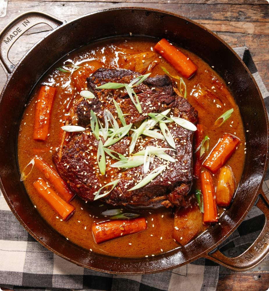 Miso-soy braised pot roast with carrots and scallions in the braiser