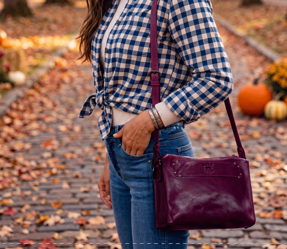 Fall color lifestyle with a purple leather crossbody
