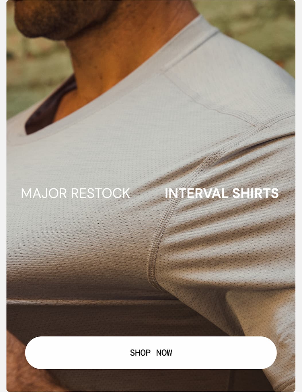 Hero Image: Active model shot showing stretch of Mineral Grey Interval Shirt