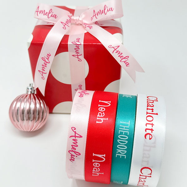 Assortment of custom woven name labels, including handknit and Made Especially For You tags