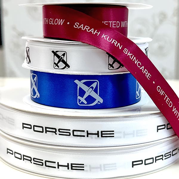 Custom woven ribbons featuring brand and company logos