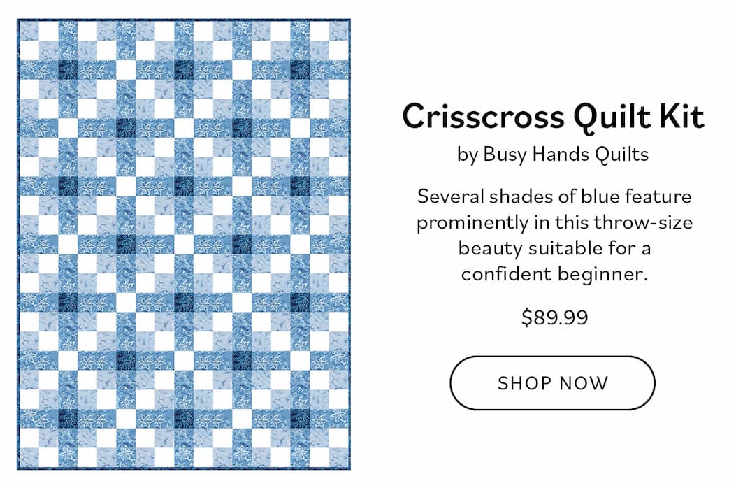 Image: A blue and white quilt with irish chain design. Text: Crisscross Quilt Kit by Busy Hands Quilts | $89.99 Oh so simple and yet a real looker of a quilt. Several shades of blue feature prominently in this throw-size beauty suitable for a confident beginner. Shop Now >>