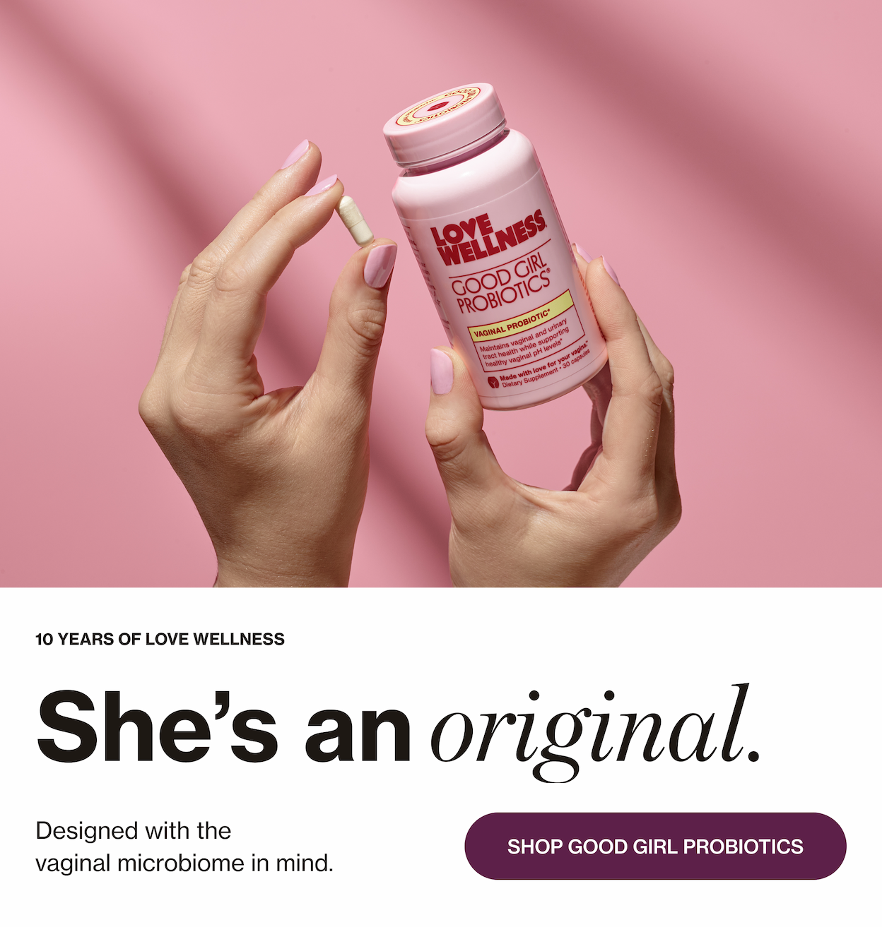 Good Girl Probiotics on a pink ground, with a capsule being held by a woman's hands 