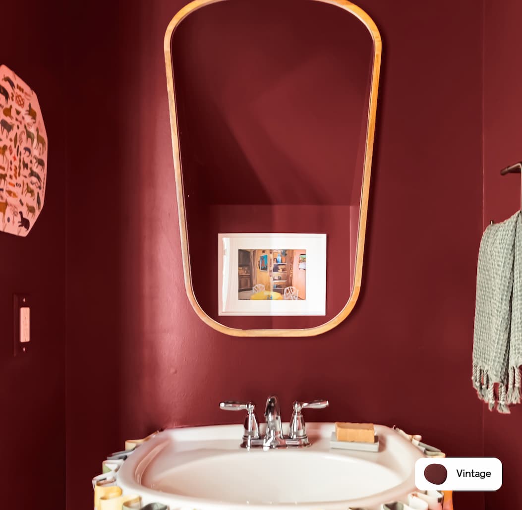 Powder room featuring dark burgundy paint color Vintage