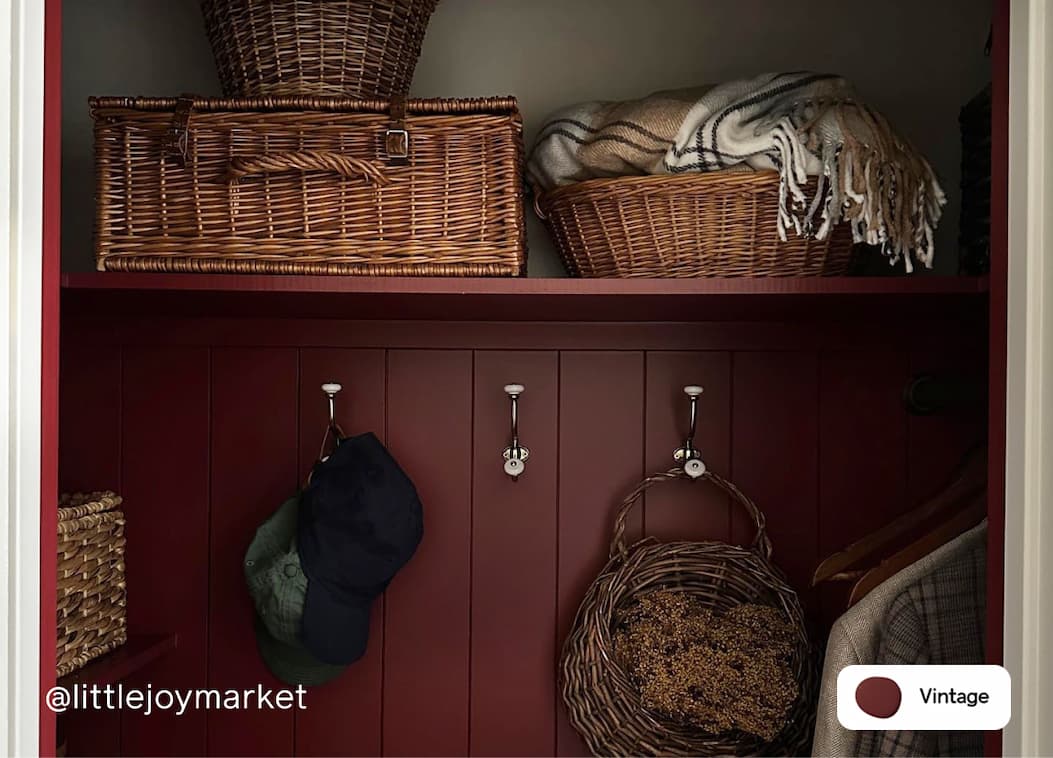 Coat closet featuring wine red paint color Vintage