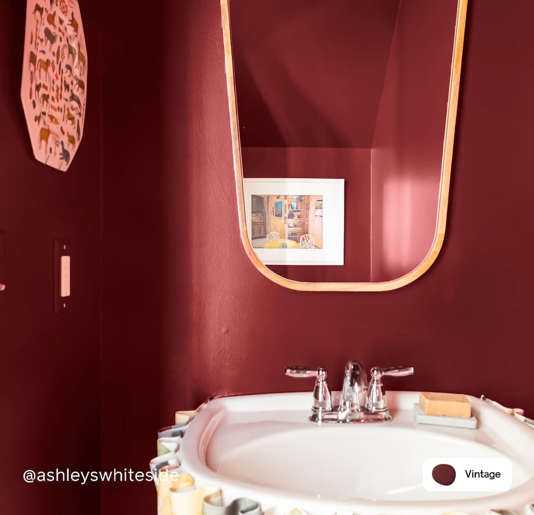 Powder room featuring dark burgundy paint color Vintage