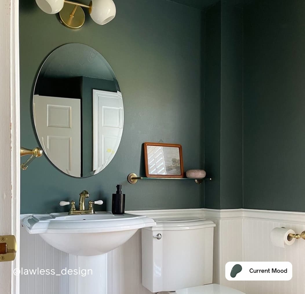 Powder room featuring moody green paint color Current Mood