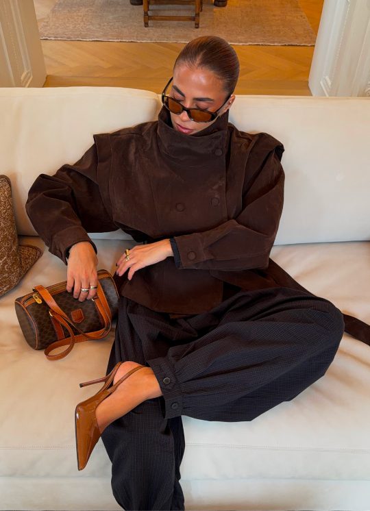 Community member in a chocolate brown coat