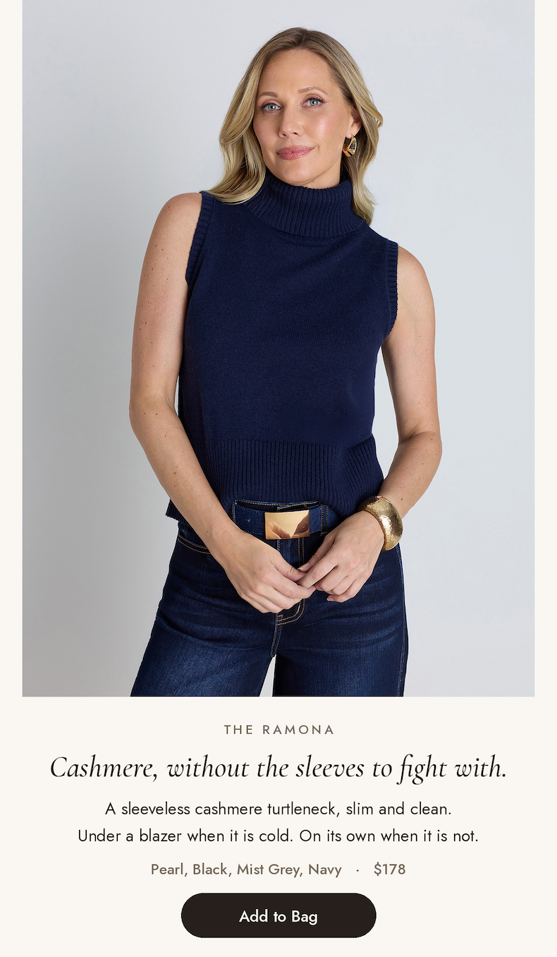 Ramona Cashmere Sleeveless Sweater in Navy, a sleeveless cashmere turtleneck worn with dark wash jeans and a gold buckle 