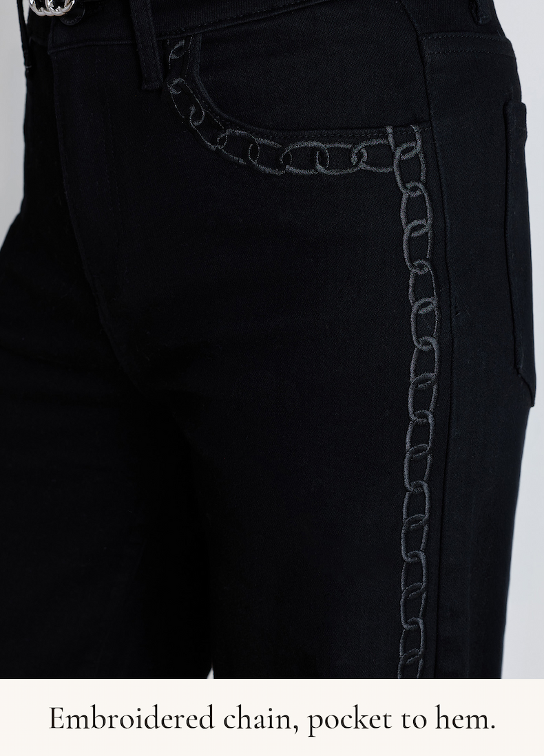 Close-up of the embroidered chain detail on the Celeste Black Chain pocket and side seam