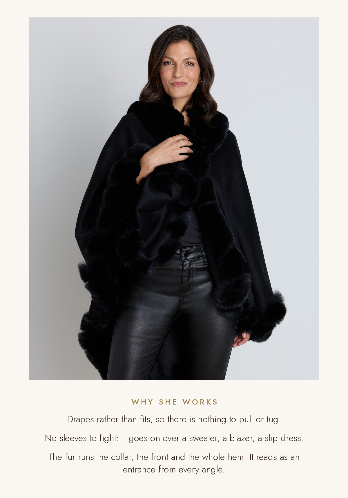 Close-up of the Ophelia cape's plush faux fur collar and front trim, worn over black. Drapes rather than fits, no sleeves to fight, fur from collar to hem.