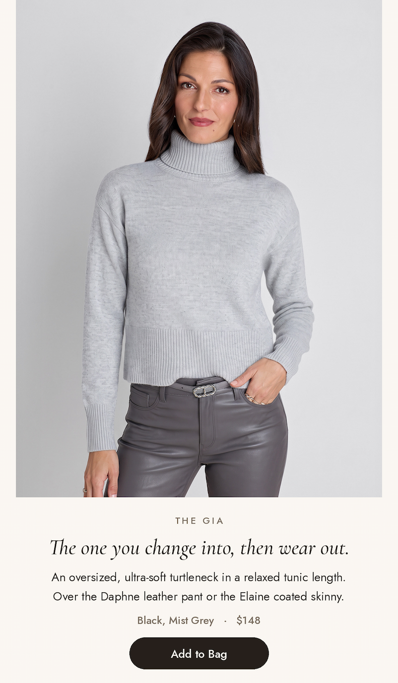 Gia Sweater in Mist Grey, an oversized soft turtleneck tunic worn with grey coated pants