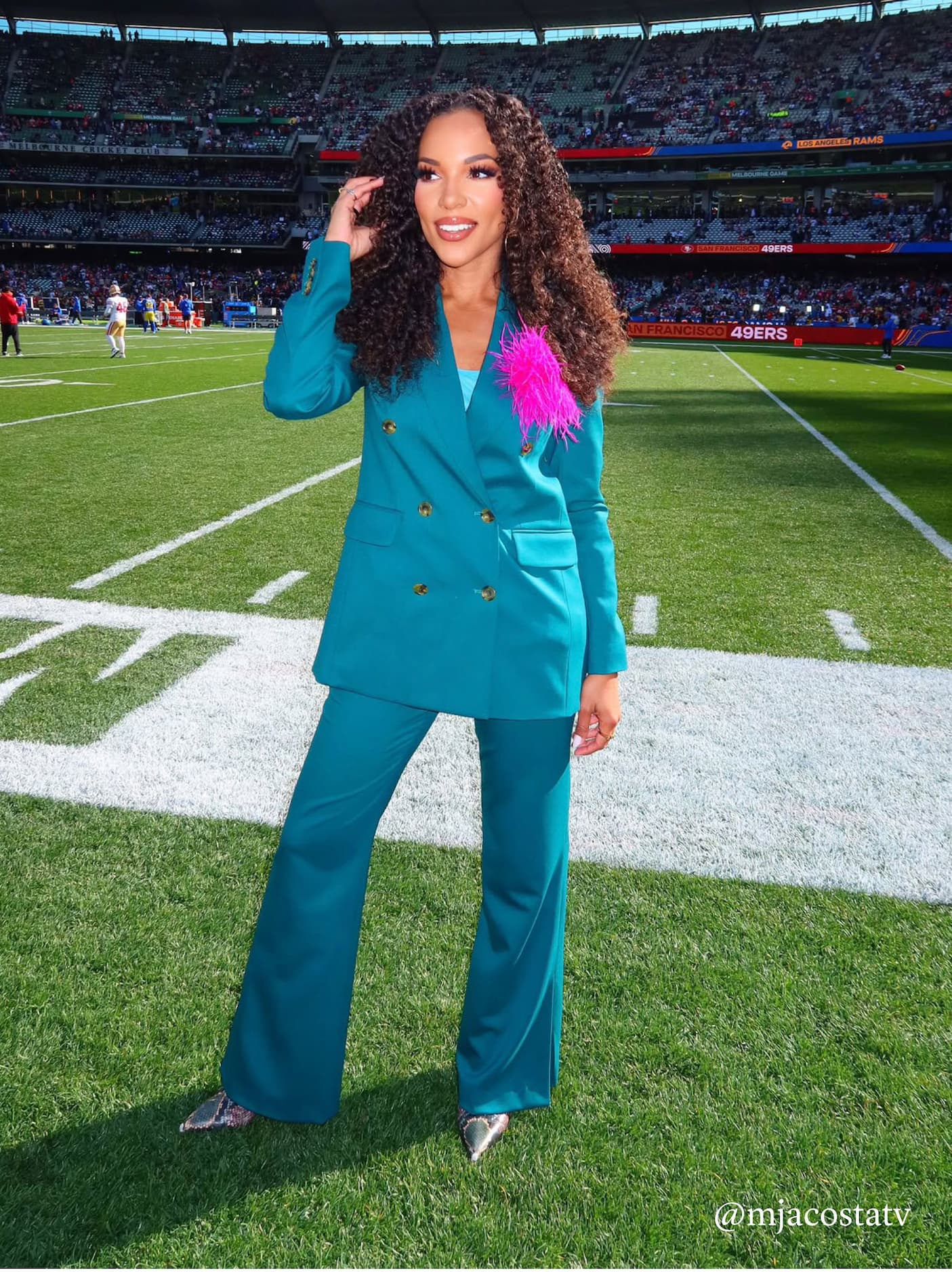 Netflix Sports’ MJ Acosta-Ruiz wearing the Double-Breasted Blazer and Prince Trouser in Seasonless Wool, Deep Teal.