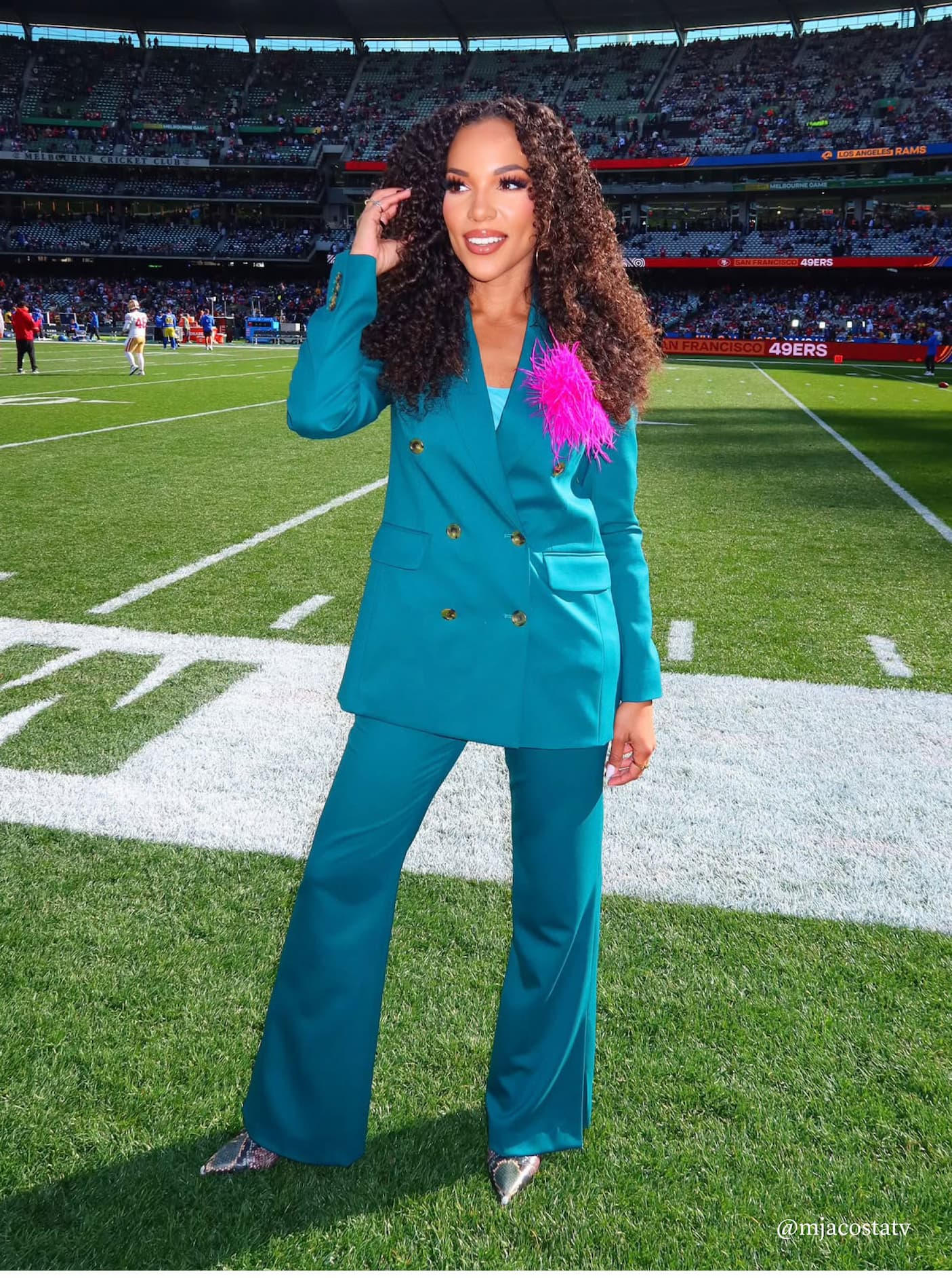 Netflix Sports’ MJ Acosta-Ruiz wearing the Double-Breasted Blazer and Prince Trouser in Seasonless Wool, Deep Teal.