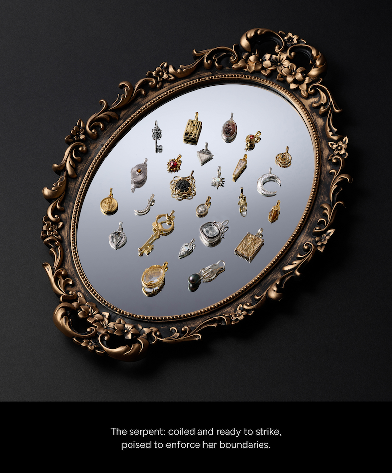 The Medusa capsule charms laid out on an ornate gold mirror. The serpent: coiled and ready to strike, poised to enforce her boundaries.