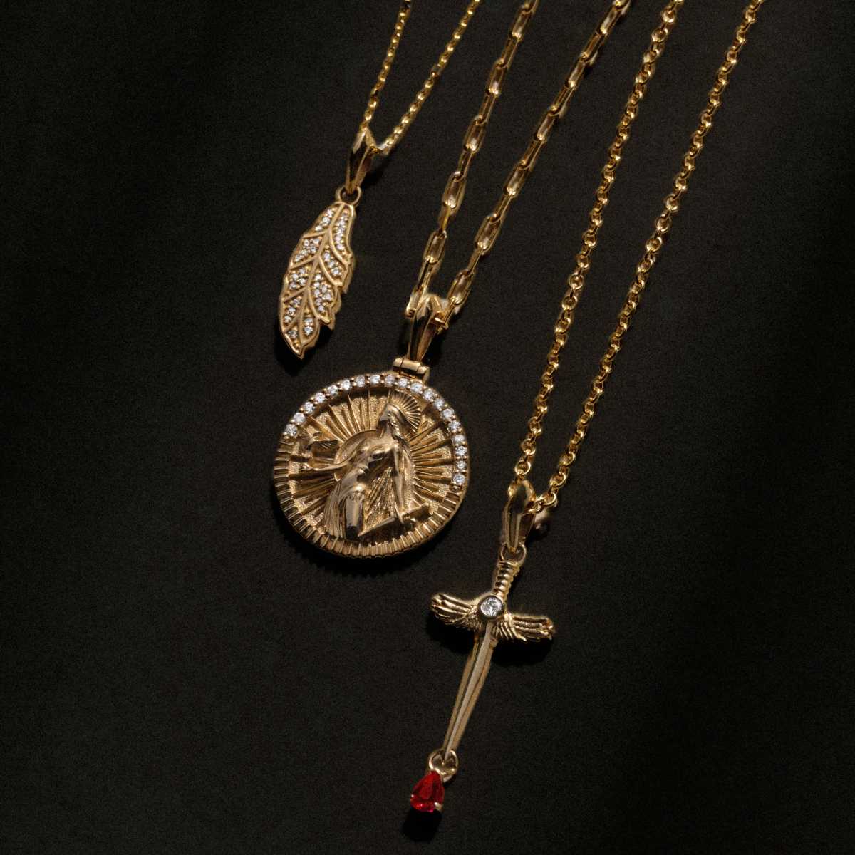 14k gold Goddess medallion, dagger and leaf pendants with diamonds on gold chains