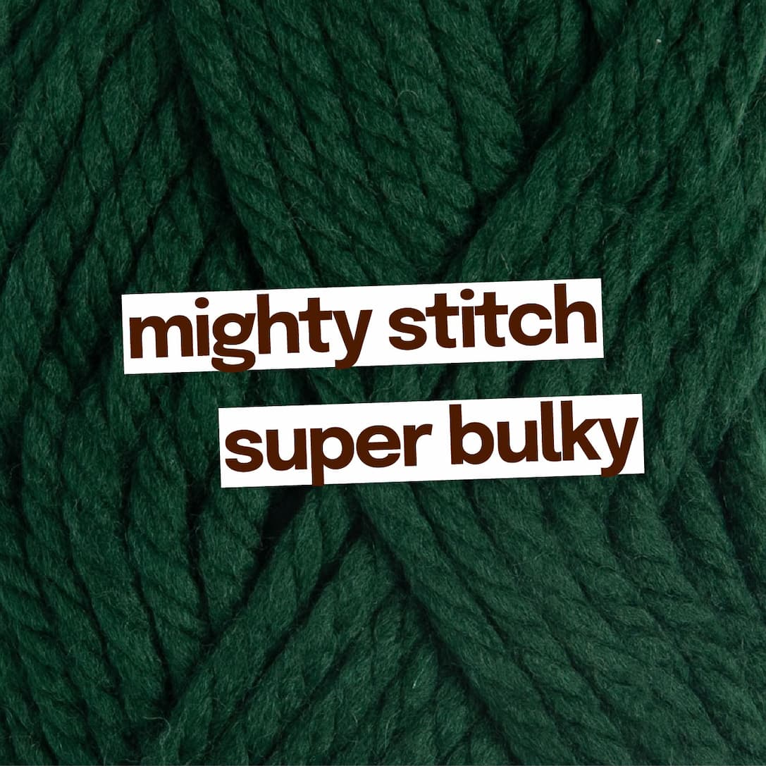 Image: Dark green bulky yarn. Text: mighty stitch super bulky >>
