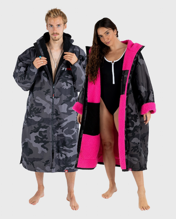 Couple in Dryrobe® Advance Black Camo and Black Camo Pink