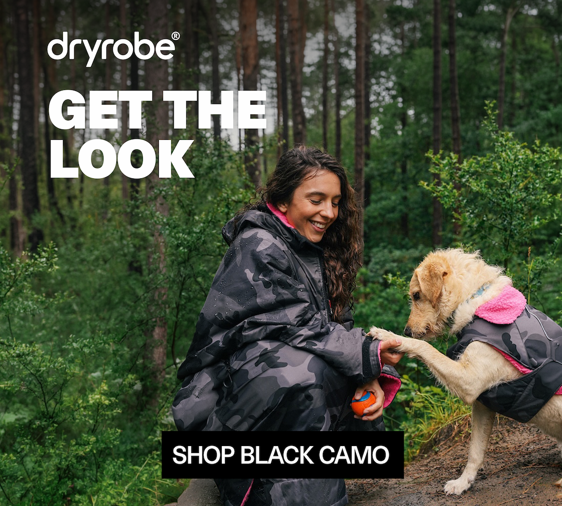 Dog on the beach wearing the Dryrobe® Dog Coat Stone Camo