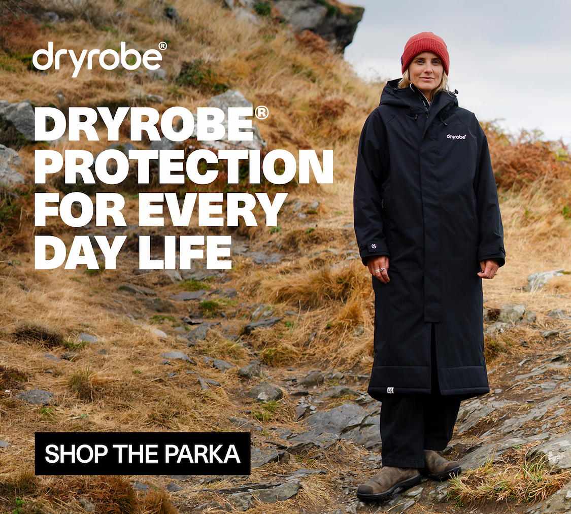 Woman on the moors wearing Dryrobe® Waterproof Parka in Black