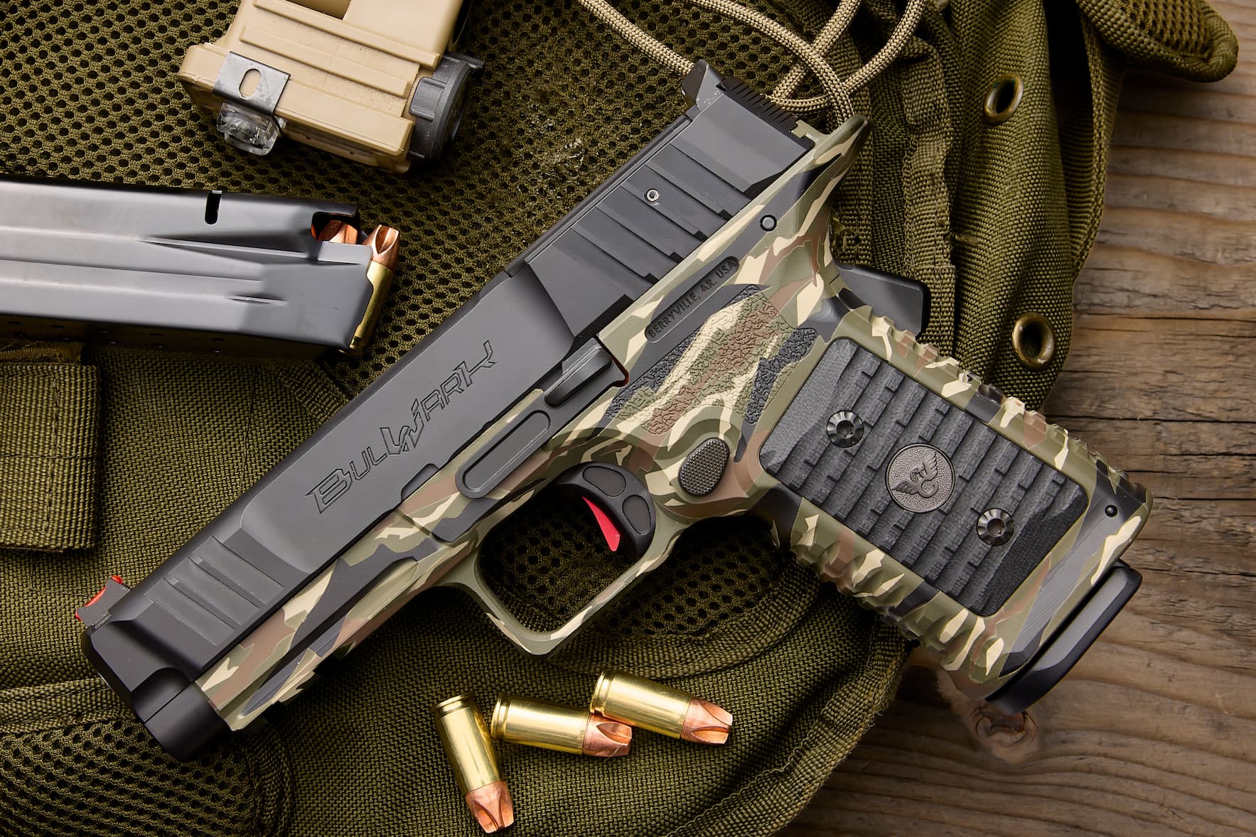 The Wilson Combat BULWARK in camo on a field pack with 9mm rounds. Explore the BULWARK. The Wilson Combat BULWARK in camo on a field pack with 9mm rounds. Explore the BULWARK.