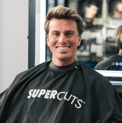 Jackson Olson in Supercuts haircut cape.