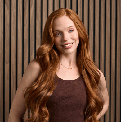 Woman with red hair in brown shirt.