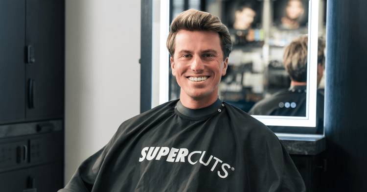Jackson Olson in Supercuts haircut cape.