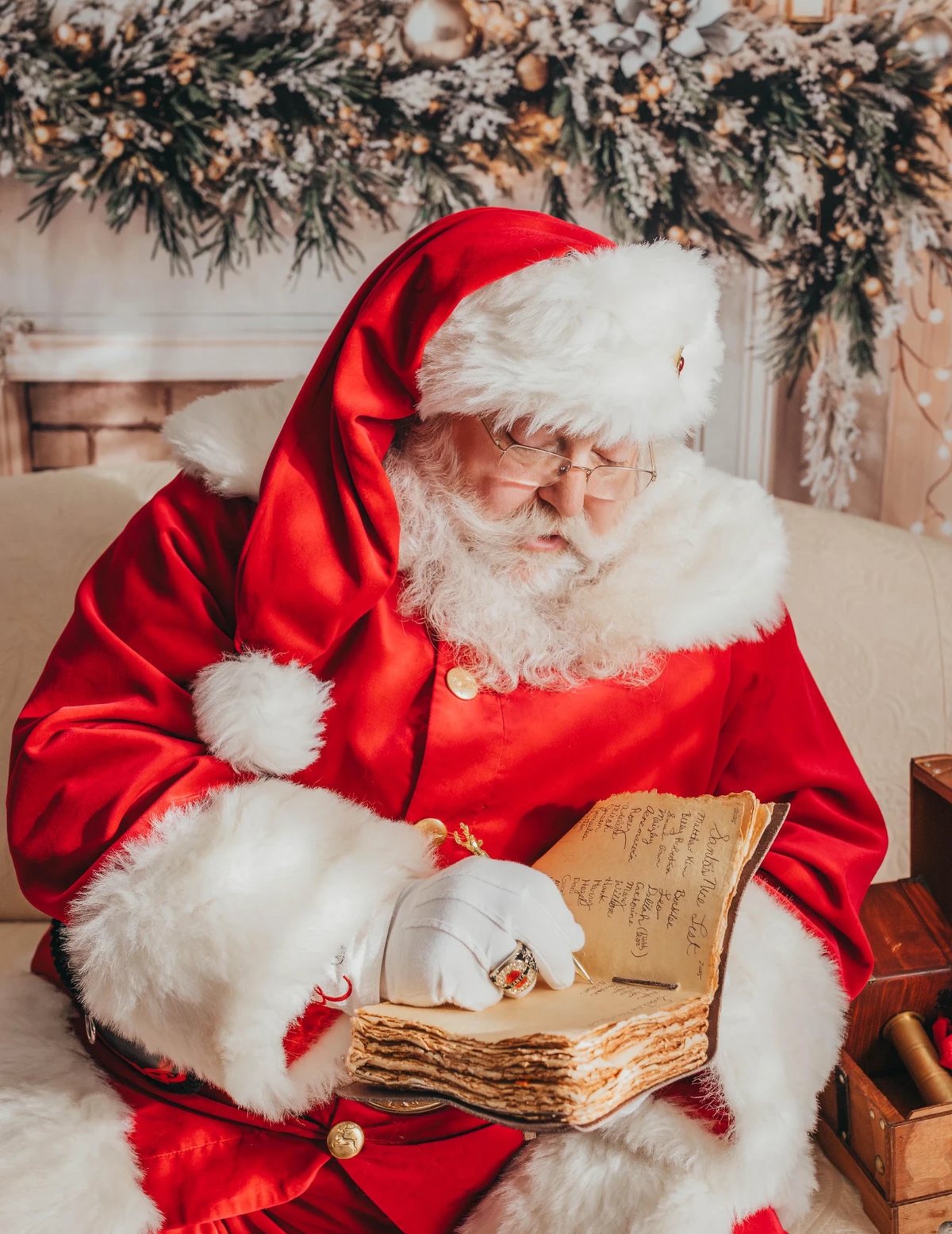 Santa in his red suit checking his nice list