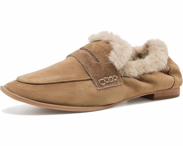 Tan suede loafer with a soft cream faux-fur lining, classic penny strap, and low stacked heel. Fearrington Village.