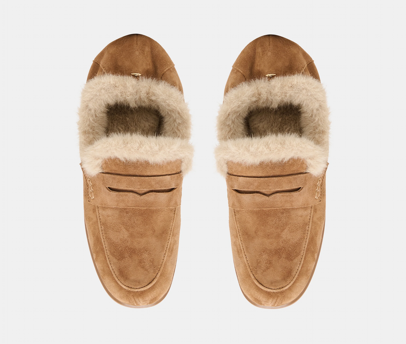 op view of tan suede loafers with soft cream faux-fur lining and classic penny straps. Fearrington Village.