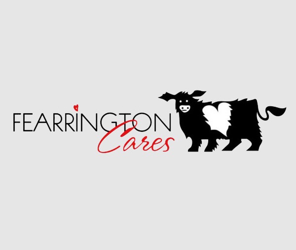 Fearrington Cares logo featuring the words “Fearrington Cares” beside a black-and-white Belted Galloway cow. Fearrington Village.