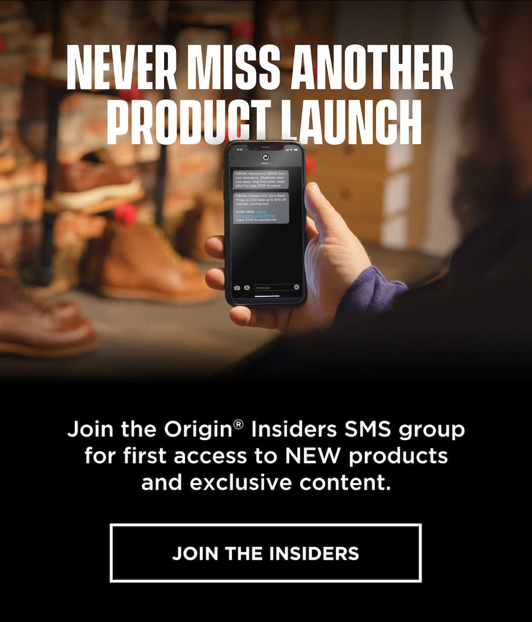 Phone displaying Origin text alerts inviting users to join SMS list for product launches and updates.