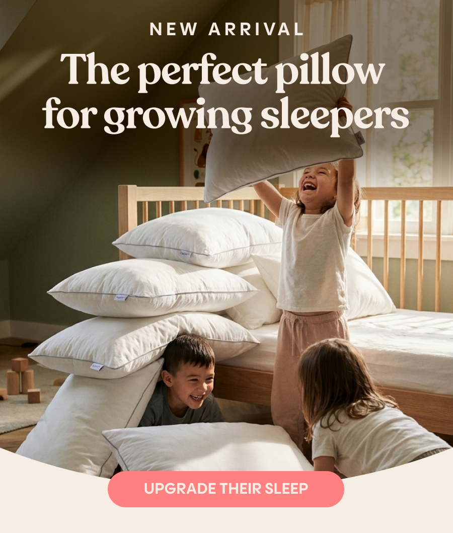 New arrival. The perfect pillow for growing sleepers. Three kids laughing and playing with pillows in a bedroom. Upgrade Their Sleep.
