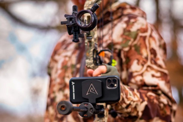 Bowhunter filming a hunt with a Painted Arrow phone mount