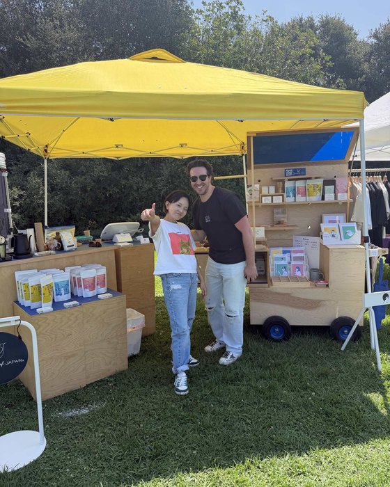 Miki with Mitchell Cote-Sawyer, who runs the Los Angeles French Fry Festival, in front of the cart