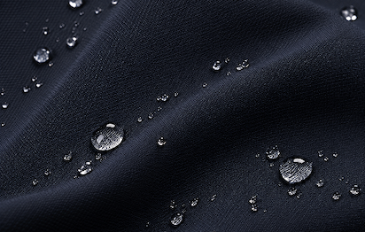 macro navy fabric showing water droplets 