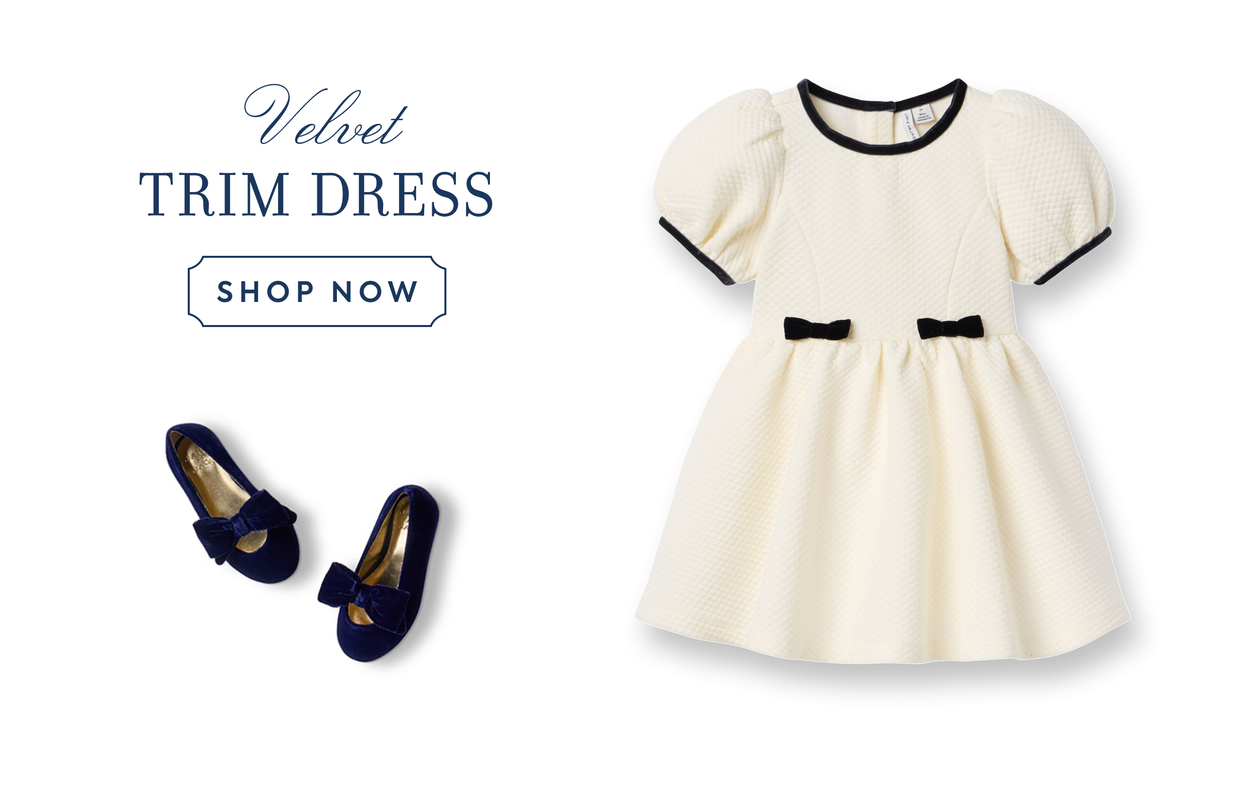 Cream quilted children's dress with navy velvet trim and bows, paired with navy velvet bow flats - Velvet Trim Dress - Shop Now