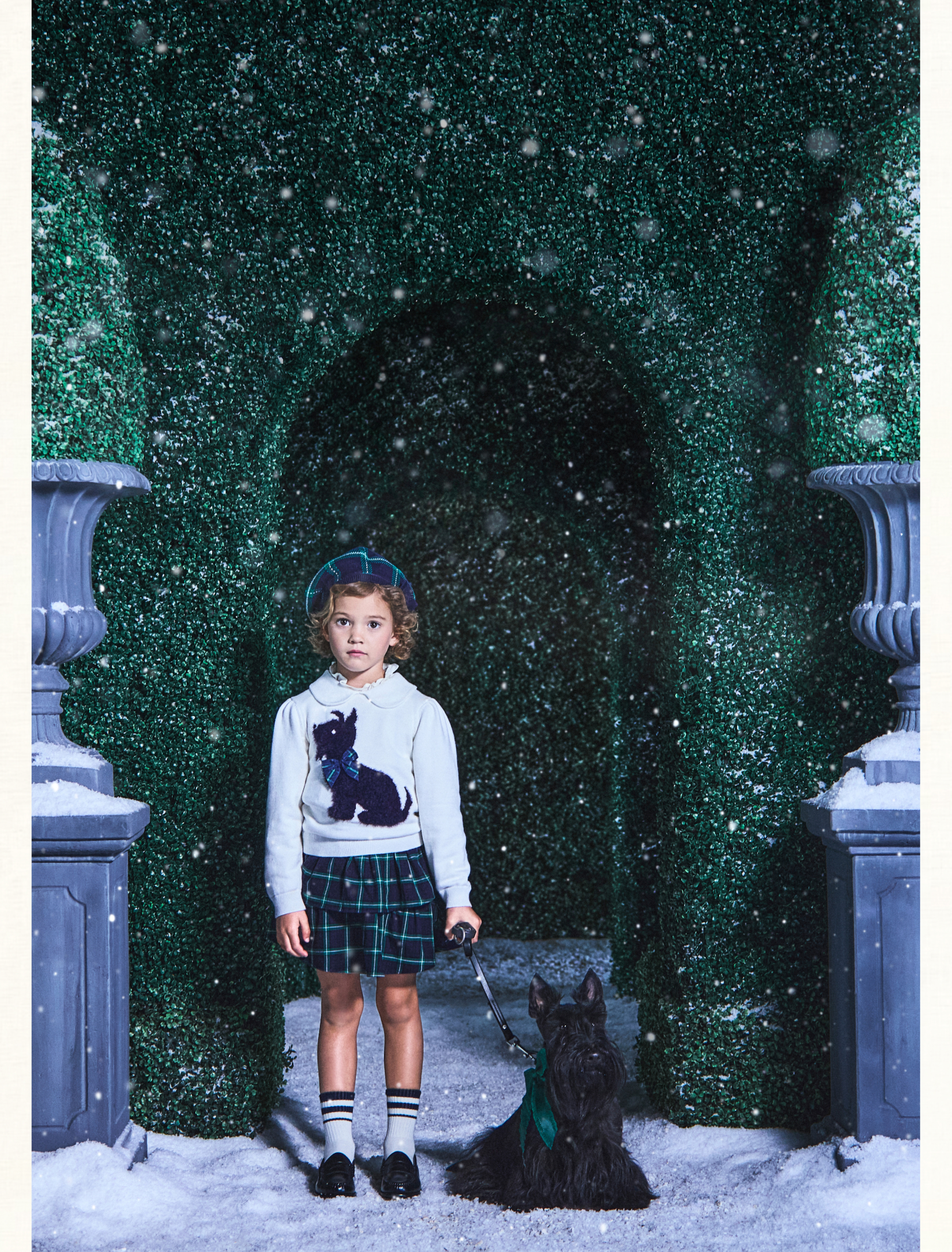Young girl wearing Scottish Terrier Collared Sweater, Tartan Tiered Skirt, and Tartan Bow Beret