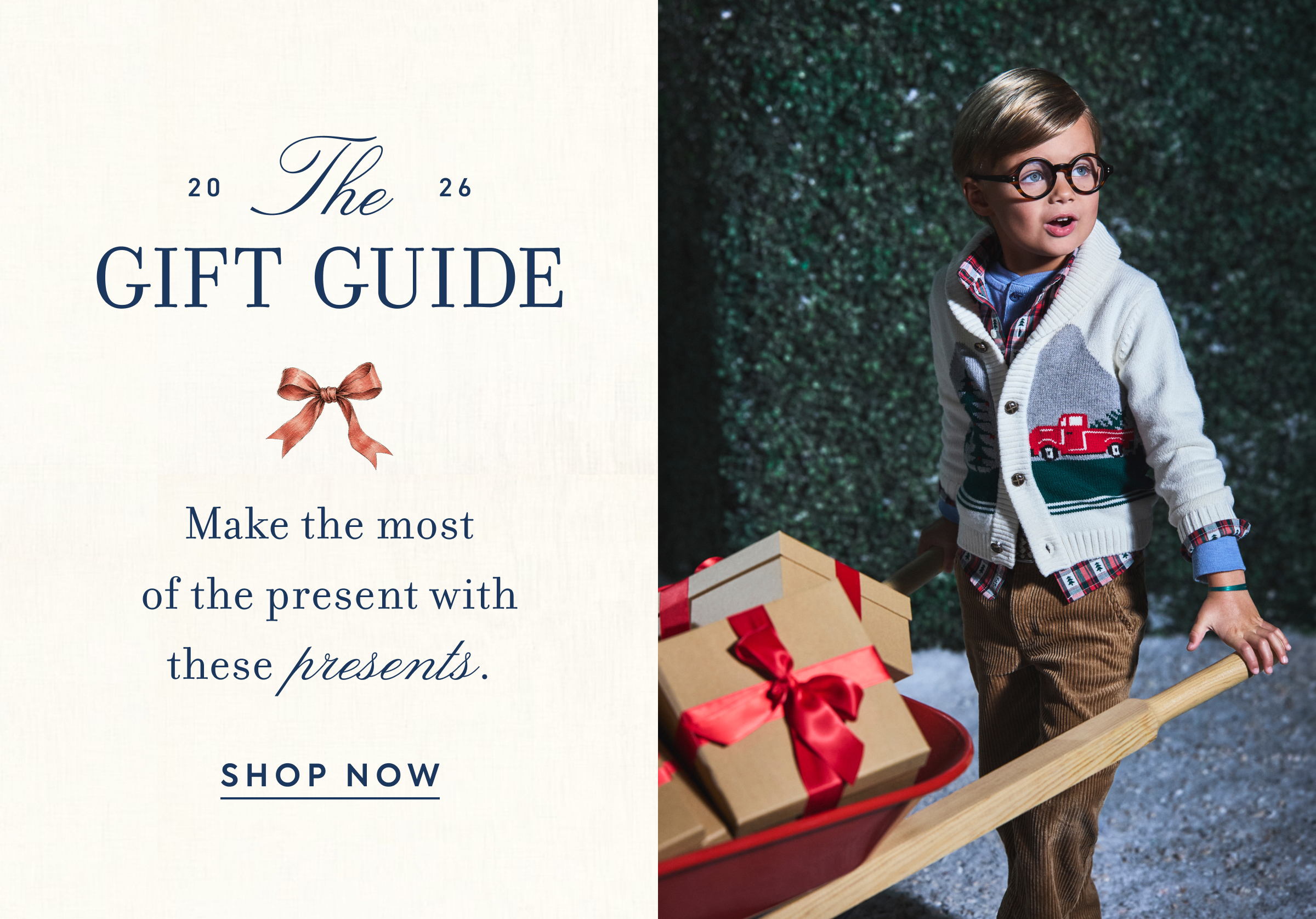 Boy pulling red wagon with wrapped gifts - 2026 The Gift Guide - Make the most of the present with these presents. - SHOP NOW
