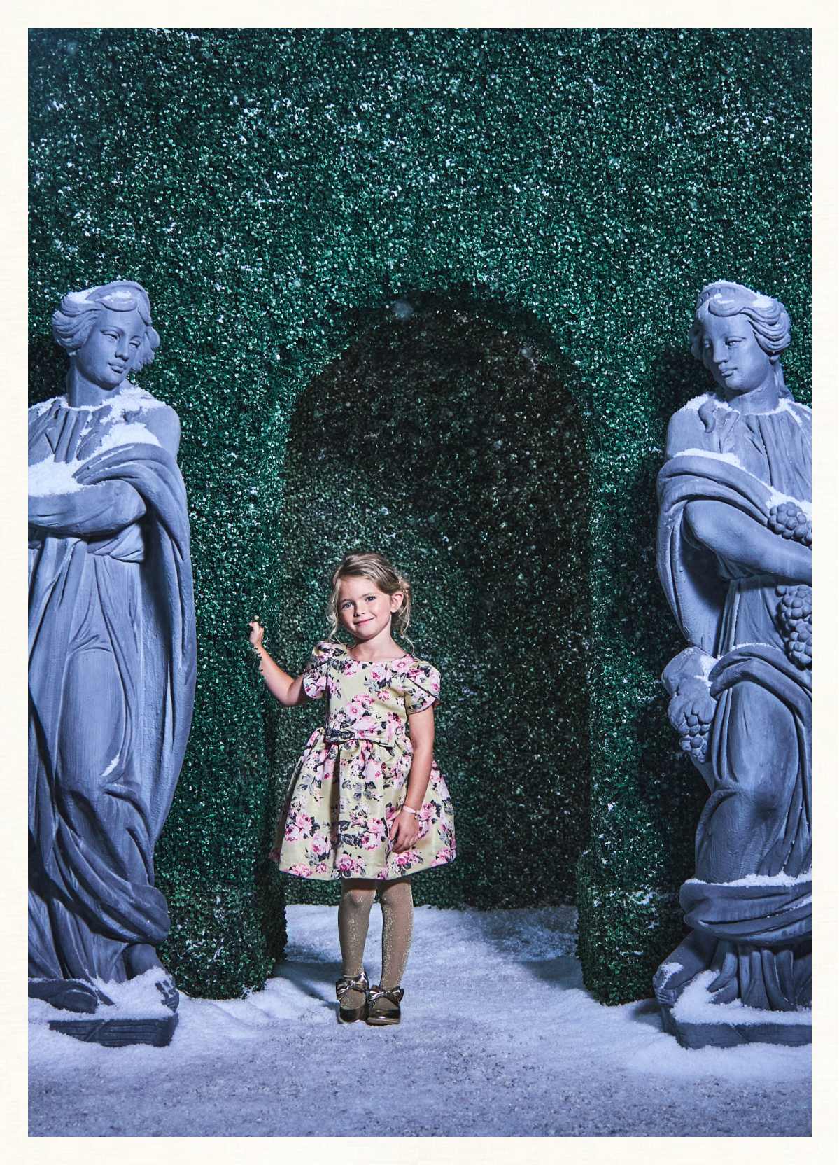 A young girl wearing The Enchanting Floral Dress