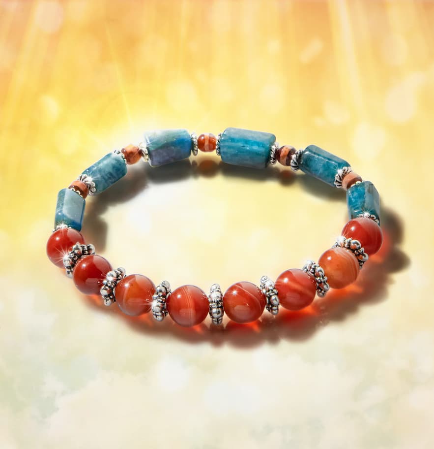 The Power Manifestation Bracelet with alternating blue apatite and red agate stones.