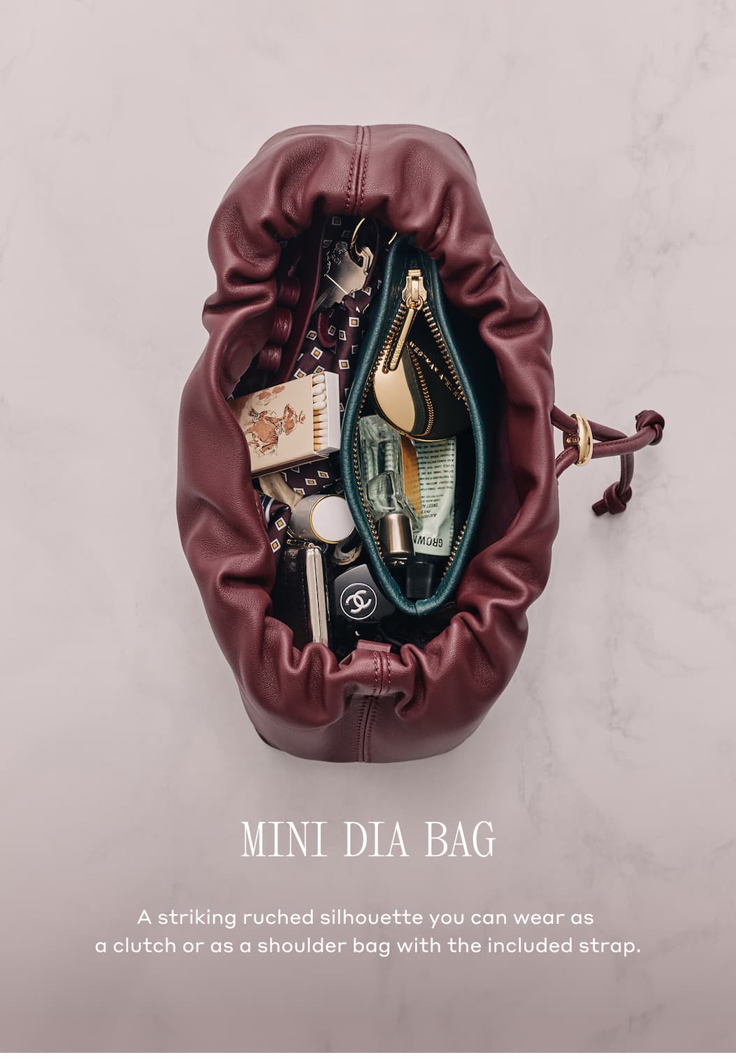 MINI DIA BAG A striking ruched silhouette you can wear as a clutch or as a shoulder bag with the included strap.