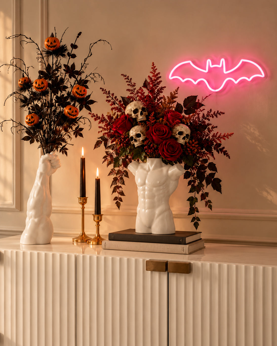 Halloween styling with sculptural vases and pink Bat neon