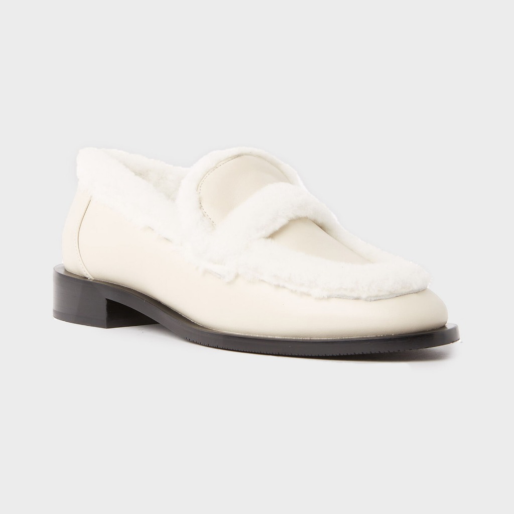 Stuart Weitzman Palmer Chill loafer in oat suede with shearling lining at Century 21 NYC