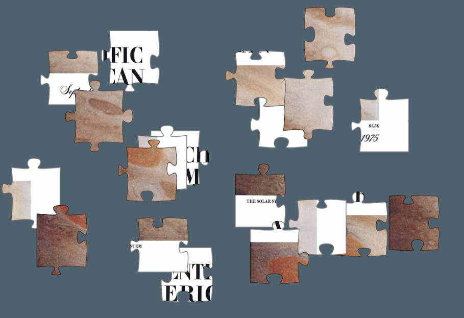 White, beige and brown puzzle pieces on a slate background.