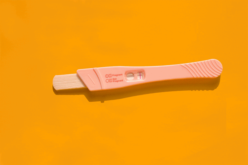 GIF of Pregnancy tests and syringes appearing on a yellow background